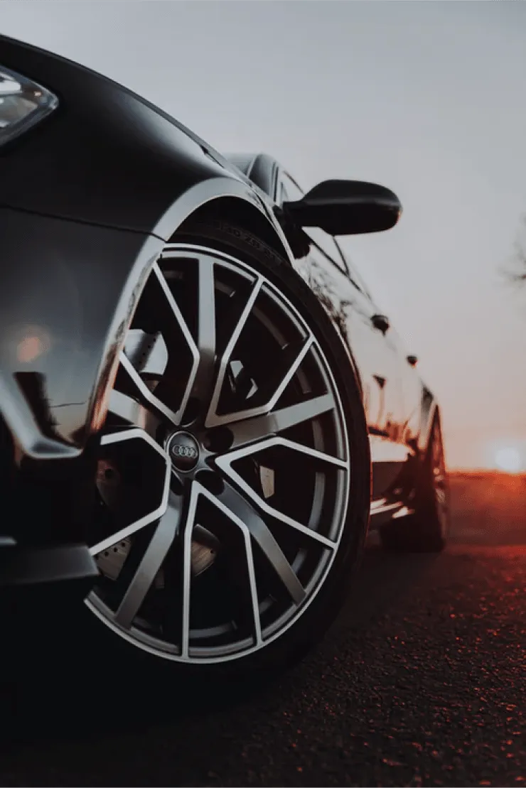 A client car on the road at sunset